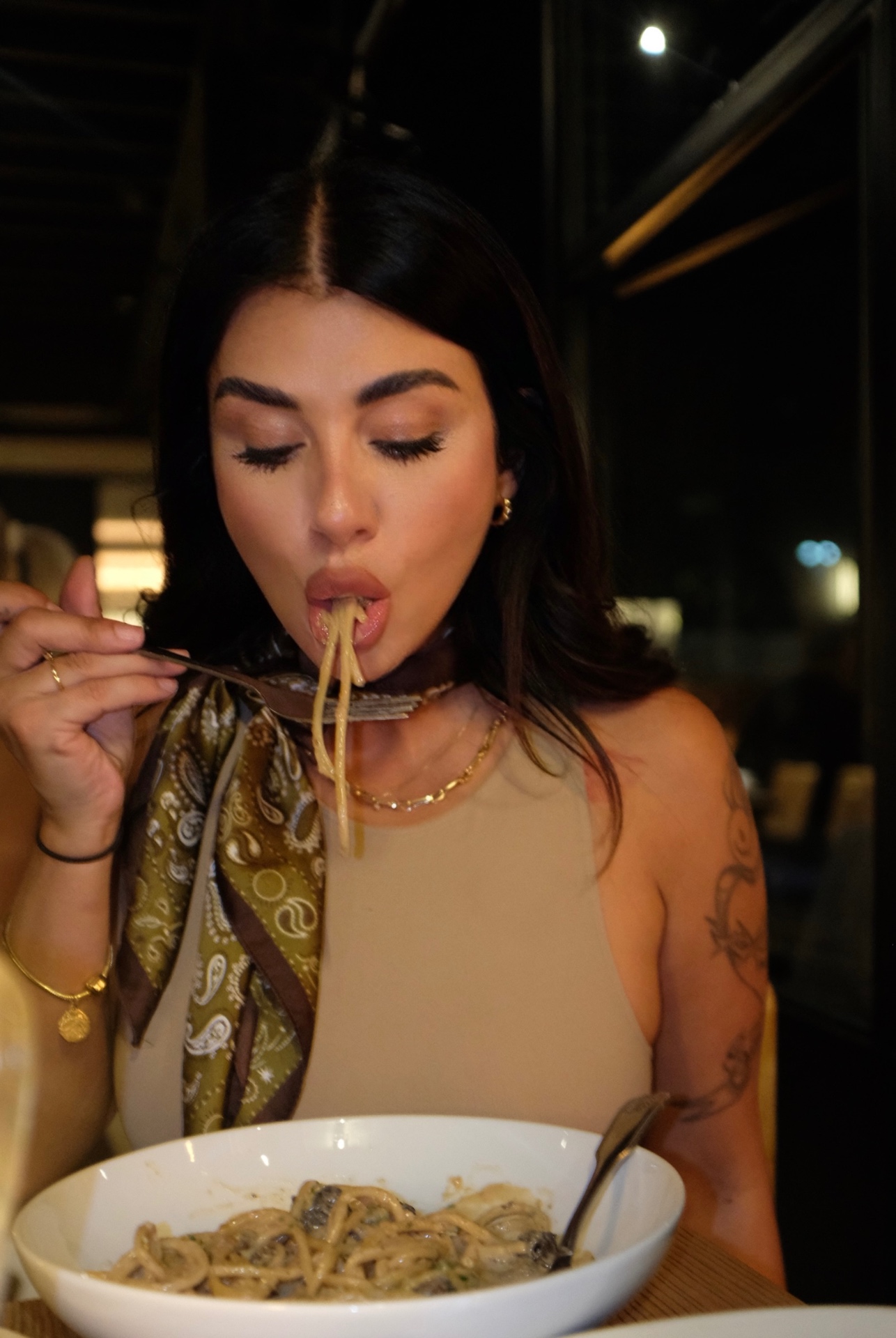 Veronica enjoying pasta at dinner